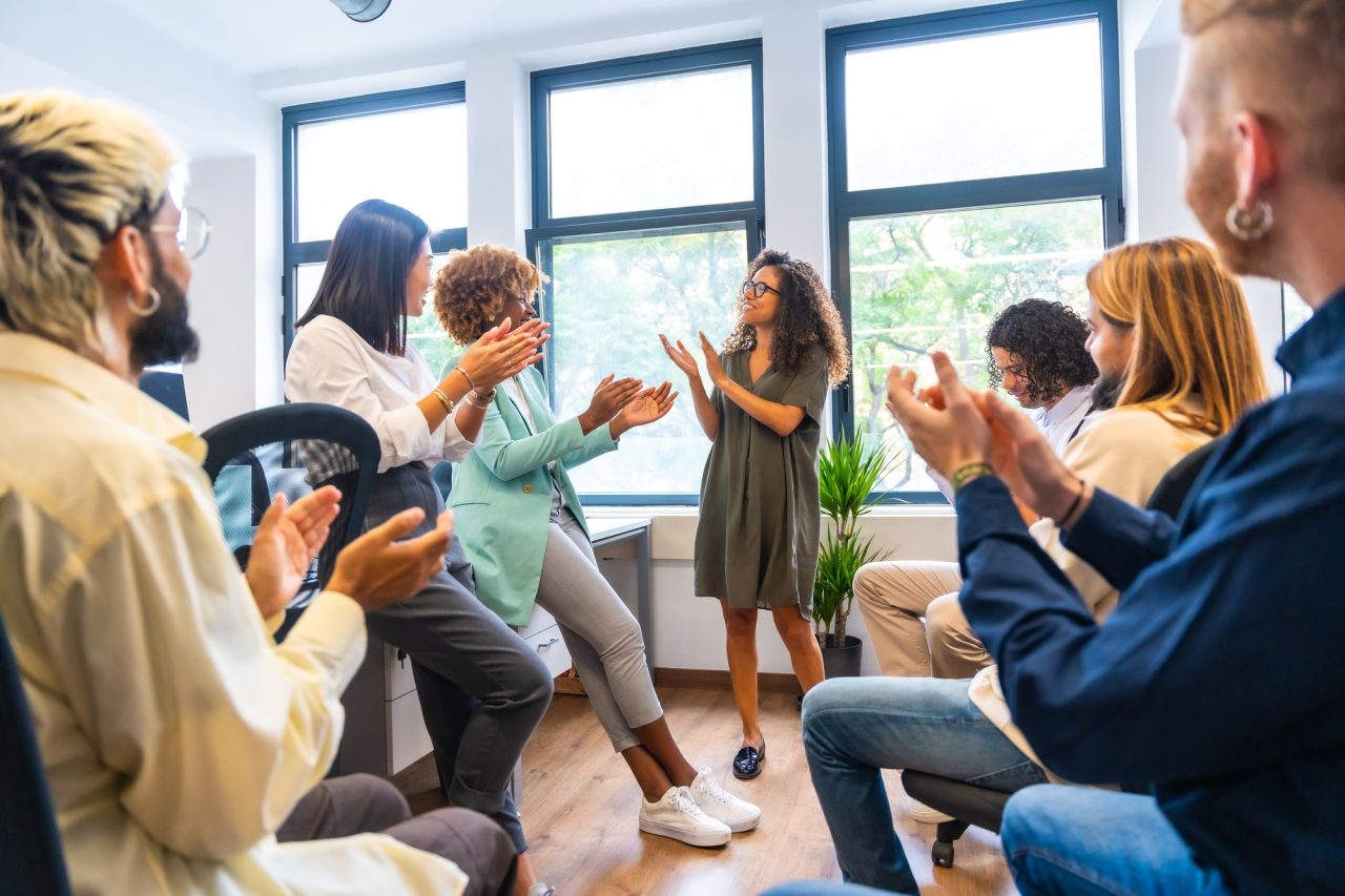 People standing in a room celebrating